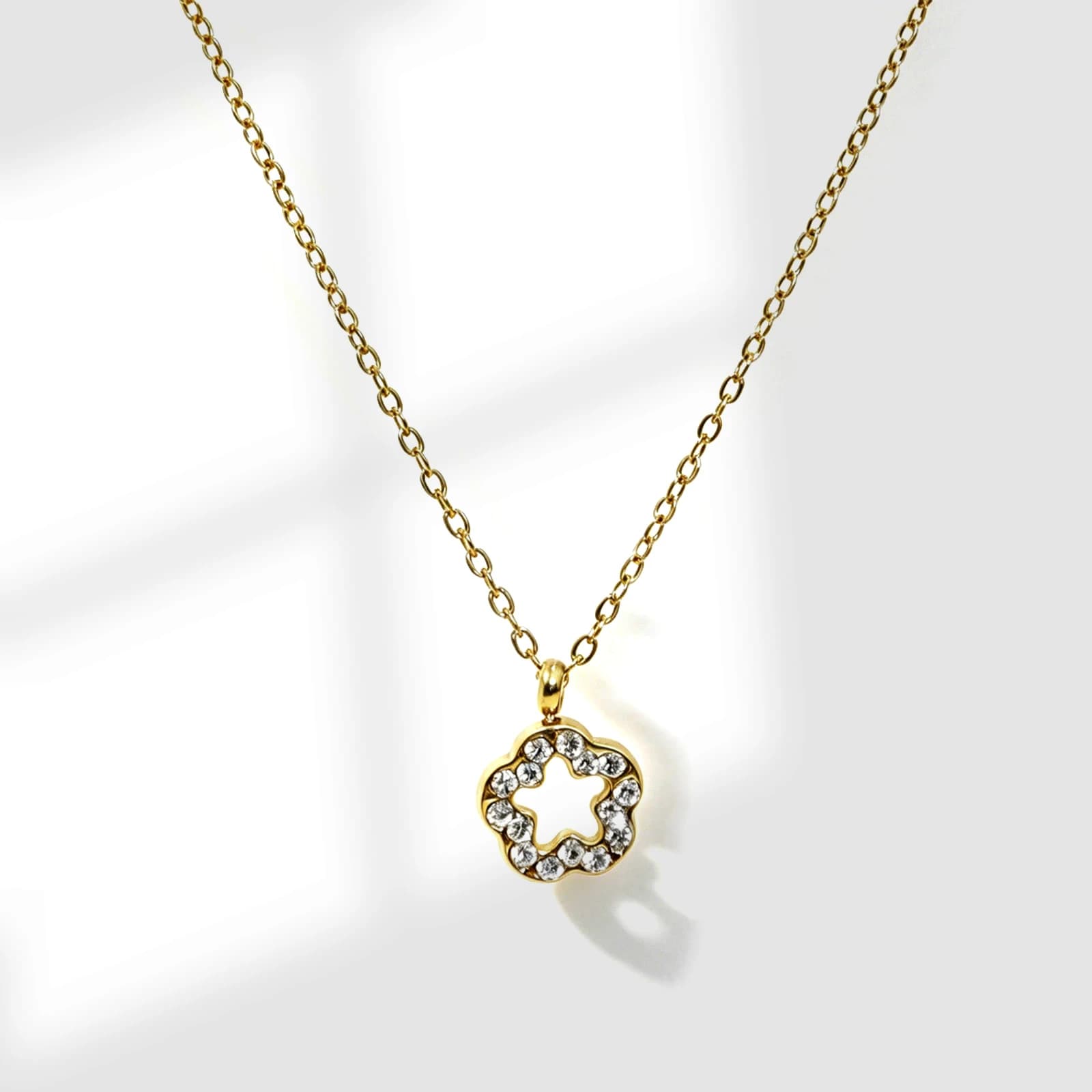 Rhinestone Flower Pendant Necklace in gold-tone stainless steel