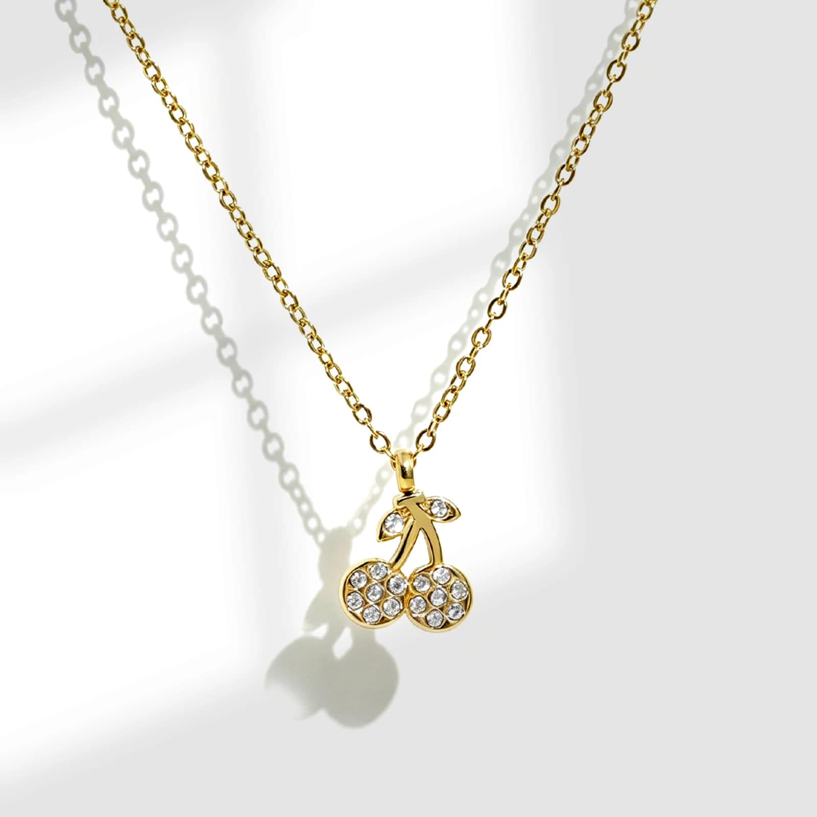 Rhinestone Cherry Pendant Necklace in gold-tone stainless steel