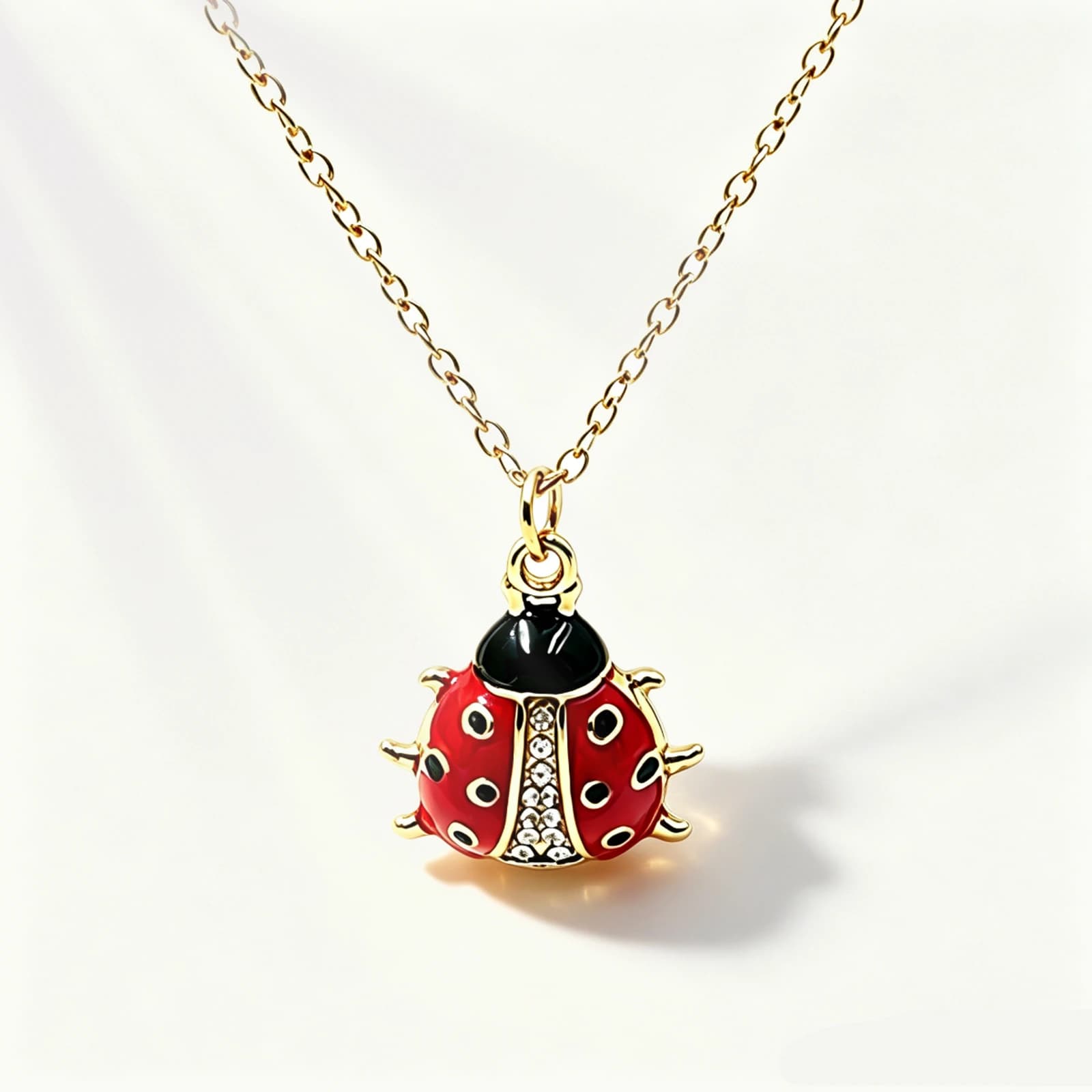 Ladybug Pendant Necklace with burgundy epoxy resin, gold-tone stainless steel